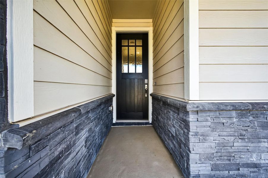 Exterior details and patio area of a home in Jordan Ranch: Signature Series, Katy (Image 27).