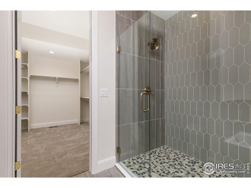 Frameless Euro shower door and full wall tile shower surround