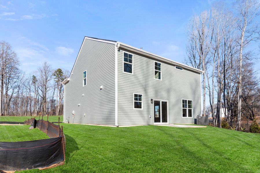 Exterior details and patio area of a home in Chandler Ridge, McLeansville (Image 21).