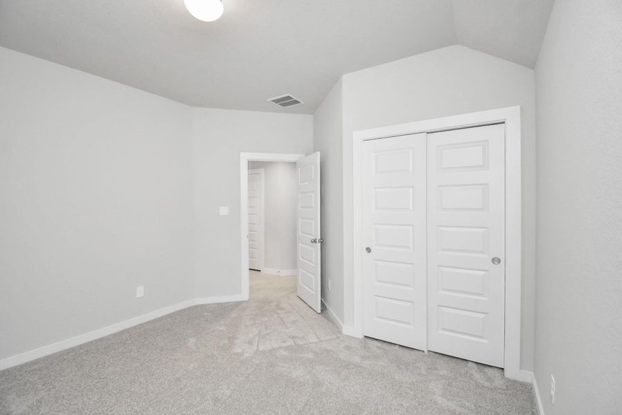 Generously sized secondary bedrooms featuring spacious closets, soft and inviting carpeting underfoot, large windows allowing plenty of natural light, and the added touch of privacy blinds for your personal retreat. Sample photo of completed home with similar floor plan. Actual colors and selections may vary. Generously sized secondary bedrooms featuring spacious closets, soft and inviting carpeting underfoot, large windows allowing plenty of natural light, and the added touch of privacy blinds for your personal retreat. Sample photo of completed home with similar floor plan. Actual colors and selections may vary.