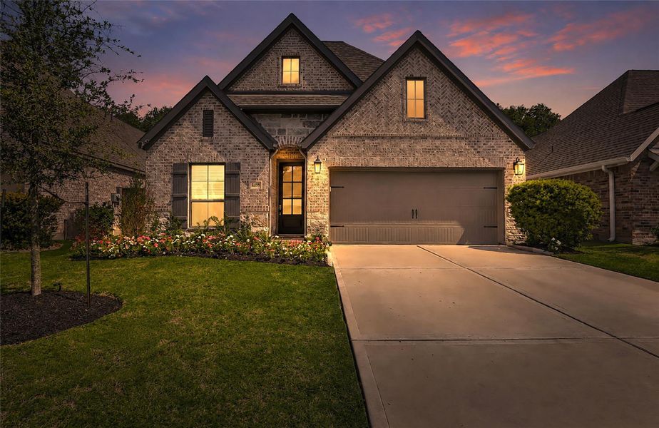 Front exterior of a new home in The Highlands, Porter, TX, highlighting curb appeal (Image 25).