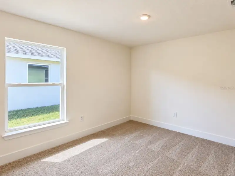 Spacious, unfurnished interior of a new home in Harmony Central, St. Cloud (Image 13).