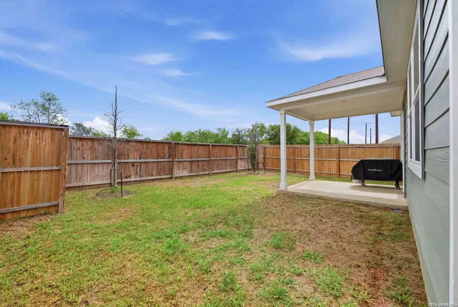 Exterior details and patio area of a home in Spring Creek, San Antonio (Image 28).