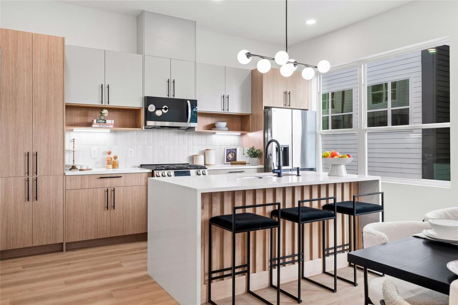 A chef-inspired kitchen designed for both beauty and function—quartz countertops, soft-close cabinetry, designer lighting, and a sleek gas range invite you to cook, gather, and make memories in a space that truly feels like home. A chef-inspired kitchen designed for both beauty and function—quartz countertops, soft-close cabinetry, designer lighting, and a sleek gas range invite you to cook, gather, and make memories in a space that truly feels like home.