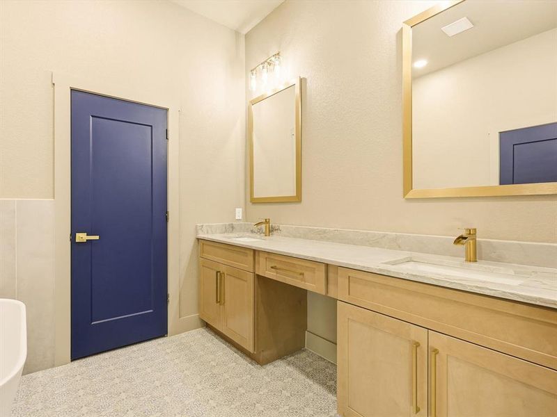 Bathroom featuring double vanity