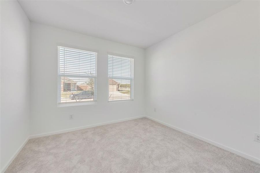 View of carpeted spare room