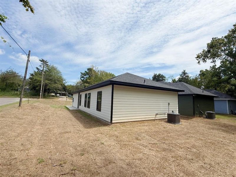 View of side of home with a central AC unit View of side of home with a central AC unit