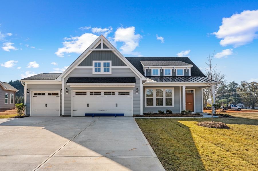 Front exterior of a new home in Windsor Forest, Anderson, SC, highlighting curb appeal (Image 1).