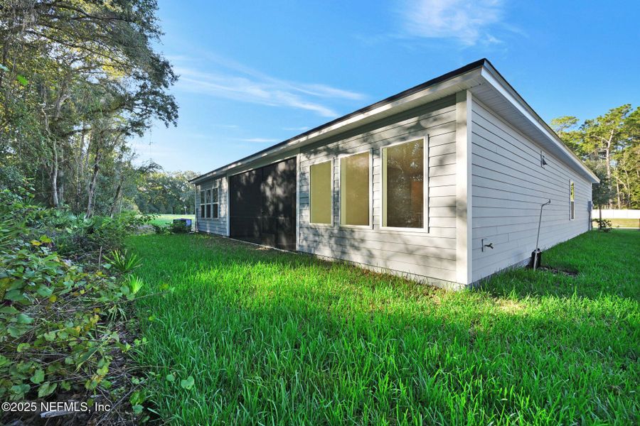 Exterior details and patio area of a home in Landing at Olde Florida, St. Augustine (Image 23).
