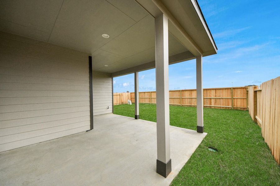 Experience outdoor living at its finest on this expansive covered patio, thoughtfully designed for BBQs and delightful outdoor dining.