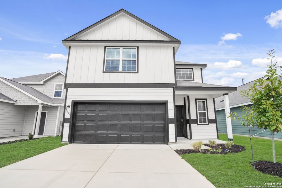 Front exterior of a new home in Dauer Ranch, New Braunfels, TX, highlighting curb appeal (Image 1). Front exterior of a new home in Dauer Ranch, New Braunfels, TX, highlighting curb appeal (Image 1).
