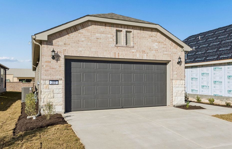 Front exterior of a new home in Sun City Texas, Georgetown, TX, highlighting curb appeal (Image 20).