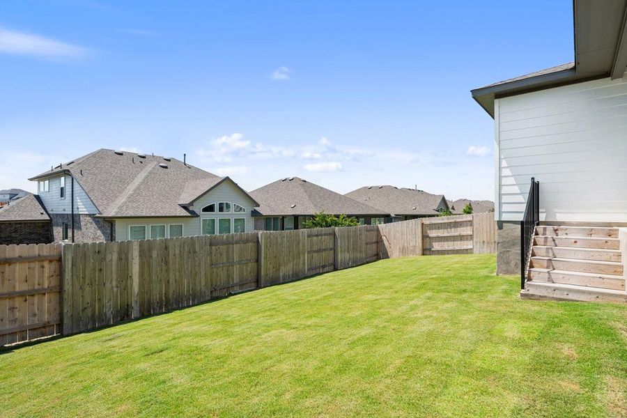 Exterior details and patio area of a home in Lariat, Liberty Hill (Image 22).