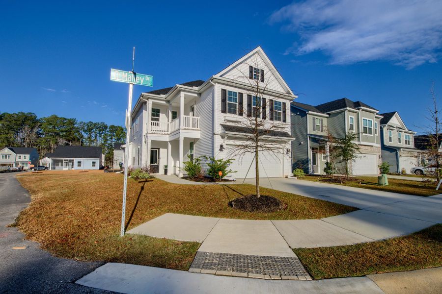 Front exterior of a new home in Six Oaks, Summerville, SC, highlighting curb appeal (Image 2). Front exterior of a new home in Six Oaks, Summerville, SC, highlighting curb appeal (Image 2).