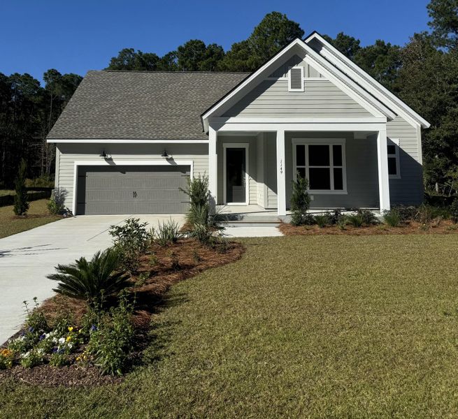 Front exterior of a new home in Hidden Ponds Reserve, Awendaw, SC, highlighting curb appeal (Image 2). Front exterior of a new home in Hidden Ponds Reserve, Awendaw, SC, highlighting curb appeal (Image 2).