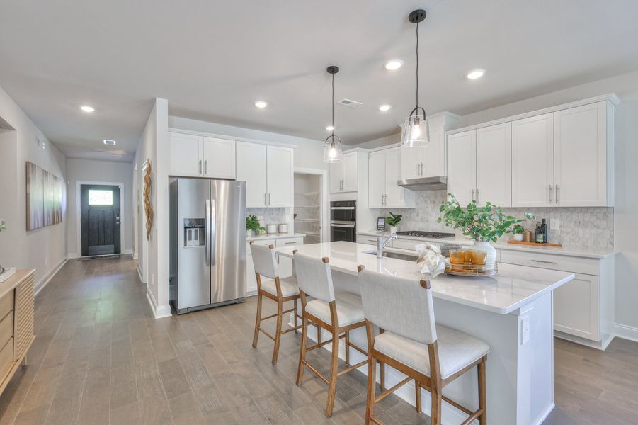 The large kitchen island is great for gatherings or getting homework done.