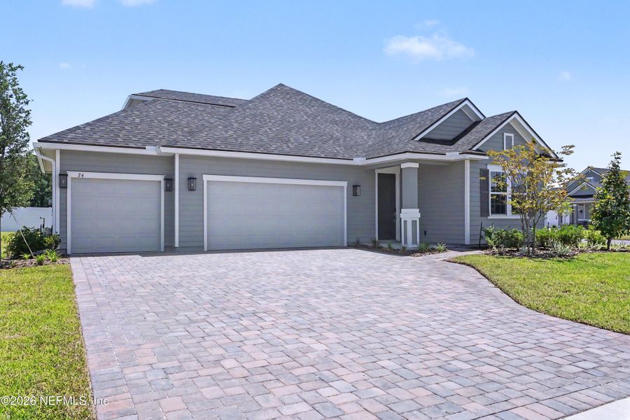 Front exterior of a new home in Brookestone, St. Augustine, FL, highlighting curb appeal (Image 2). Front exterior of a new home in Brookestone, St. Augustine, FL, highlighting curb appeal (Image 2).