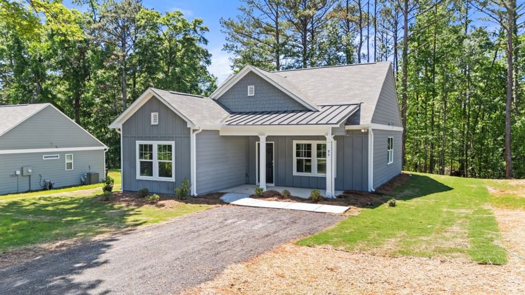 Front exterior of a new home in Clemit Harris Place, Newnan, GA, highlighting curb appeal (Image 4). Front exterior of a new home in Clemit Harris Place, Newnan, GA, highlighting curb appeal (Image 4).