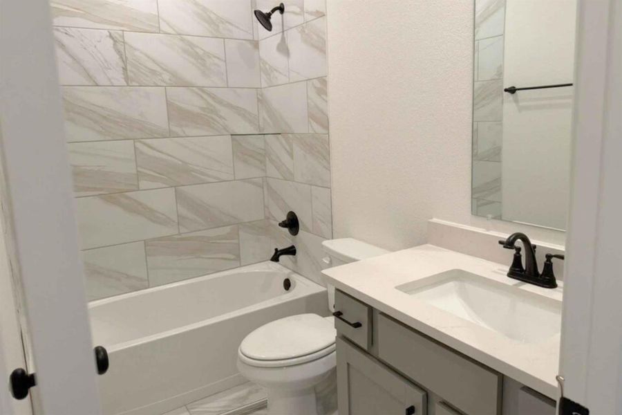 Full bathroom featuring vanity and shower / bathtub combination