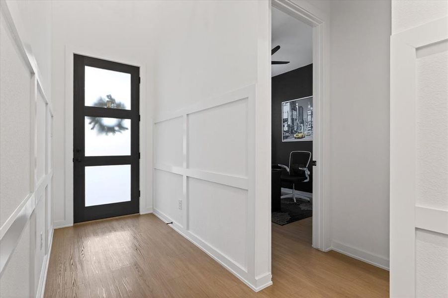Foyer entrance featuring light wood finished floors and ceiling fan Foyer entrance featuring light wood finished floors and ceiling fan