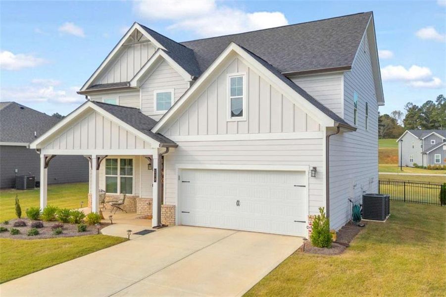Front exterior of a new home in , Homer, GA, highlighting curb appeal (Image 23).