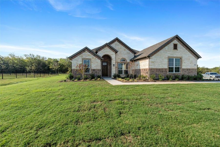 Front exterior of a new home in Vista Oaks Estates, Royse City, TX, highlighting curb appeal (Image 25).