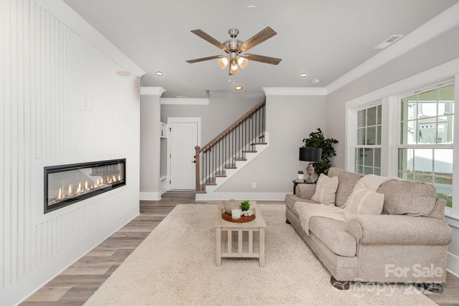 Family room with fireplace and accent wall