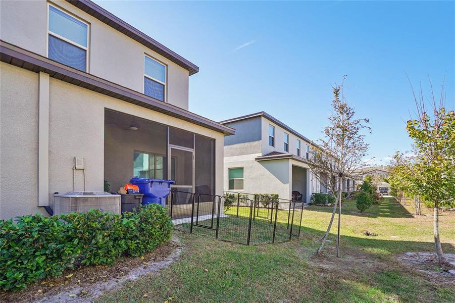 Exterior details and patio area of a home in Bryant Square: The Townes, New Port Richey (Image 22).