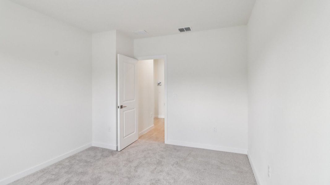 Guest Bed in the Monterey End Townhome by DRB Homes - Cyrene at Harmony in St Cloud FL