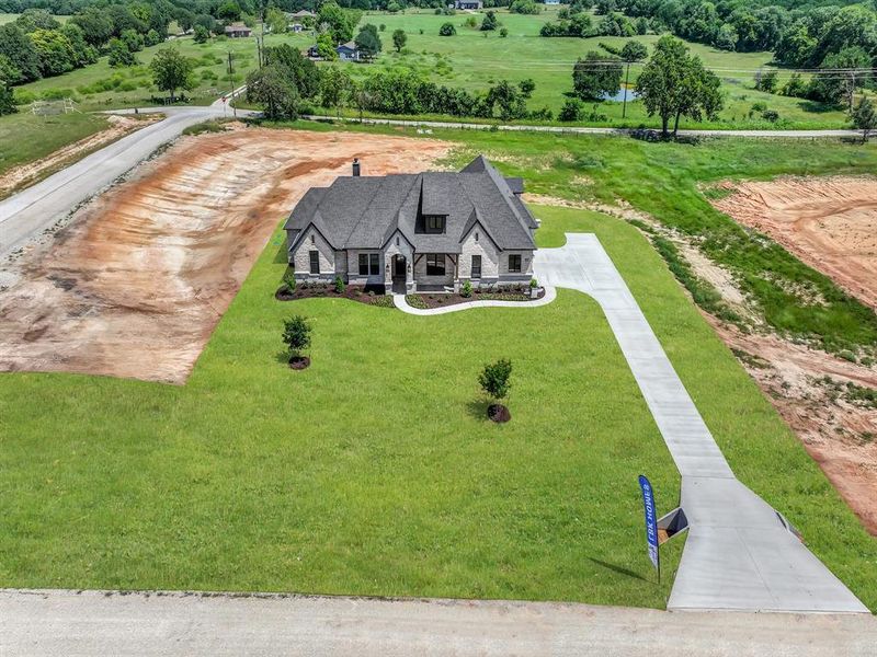 Front exterior of a new home in , Decatur, TX, highlighting curb appeal (Image 27).