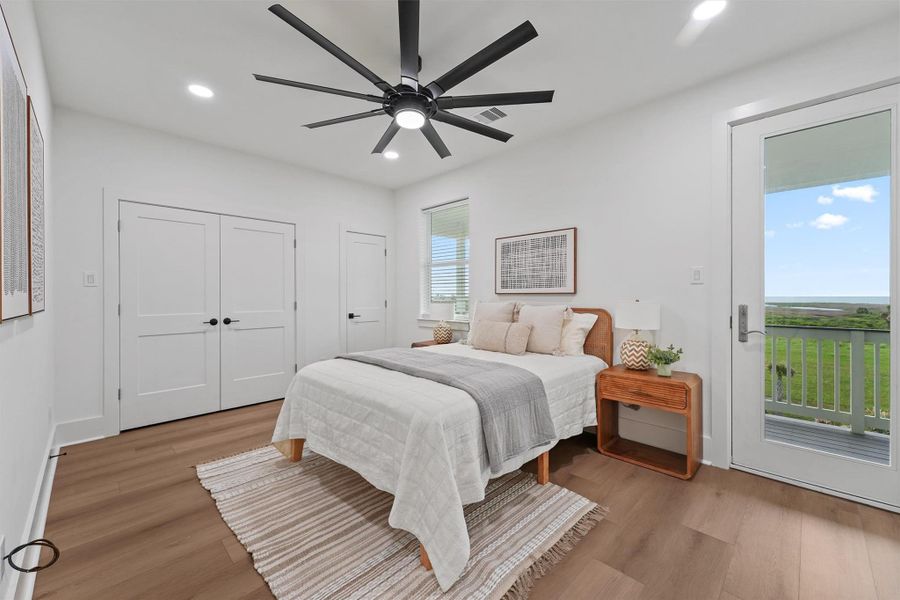 Second primary suite upstairs with direct deck access and water views—ideal for multigenerational living or elevated guest space. Second primary suite upstairs with direct deck access and water views—ideal for multigenerational living or elevated guest space.