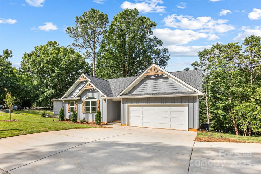 Front exterior of a new home in , Tega Cay, SC, highlighting curb appeal (Image 25).