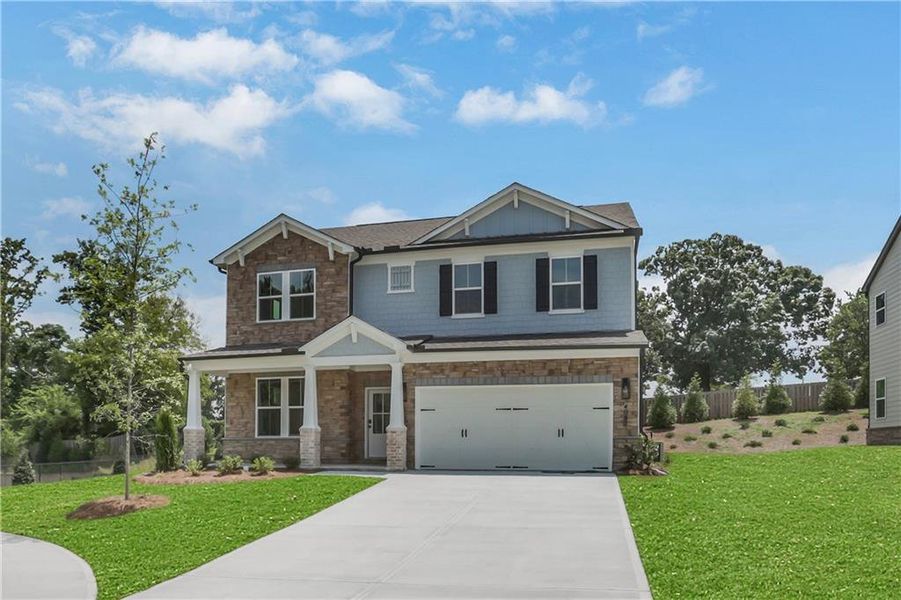 Front exterior of a new home in The Paddocks at Doc Hughes, Buford, GA, highlighting curb appeal (Image 26). Front exterior of a new home in The Paddocks at Doc Hughes, Buford, GA, highlighting curb appeal (Image 26).
