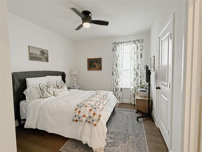 Bedroom featuring wood finished floors and ceiling fan Bedroom featuring wood finished floors and ceiling fan