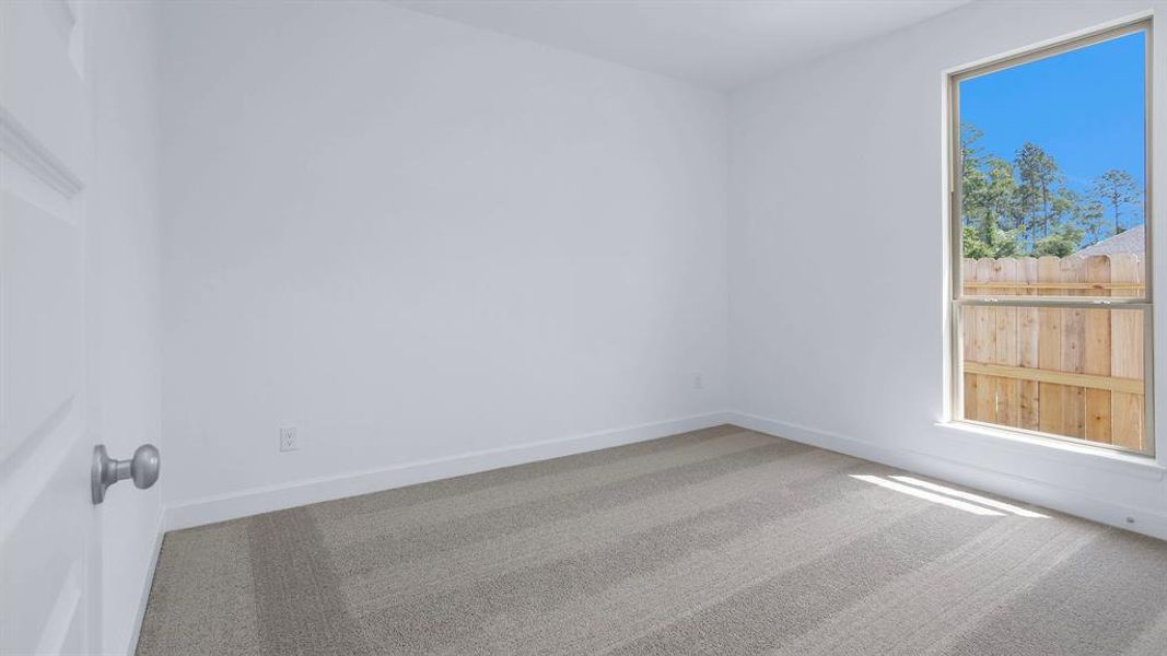 Spacious, unfurnished interior of a new home in Artavia 45', Conroe (Image 8).