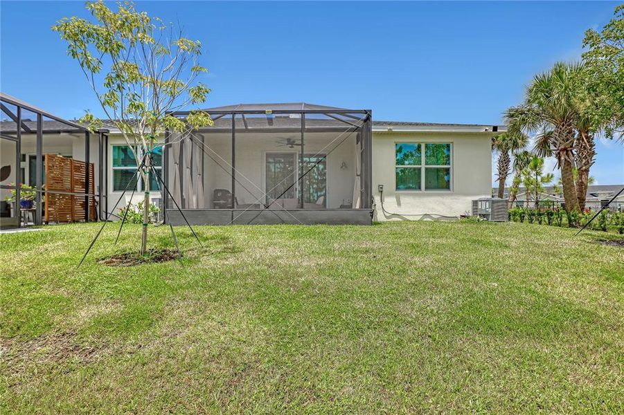 Exterior details and patio area of a home in The Timbers at Everlands, Palm Bay (Image 27).