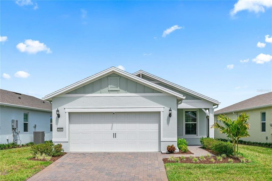 Front exterior of a new home in , St. Cloud, FL, highlighting curb appeal (Image 2).