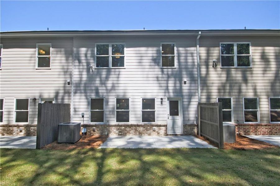 Front exterior of a new home in River Walk Place, Lawrenceville, GA, highlighting curb appeal (Image 2). Front exterior of a new home in River Walk Place, Lawrenceville, GA, highlighting curb appeal (Image 2).