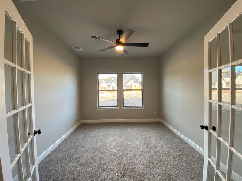 Great study with French doors & ceiling fan