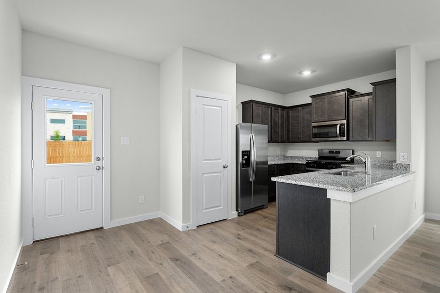 The dining room has a large window that lets in great, natural light.