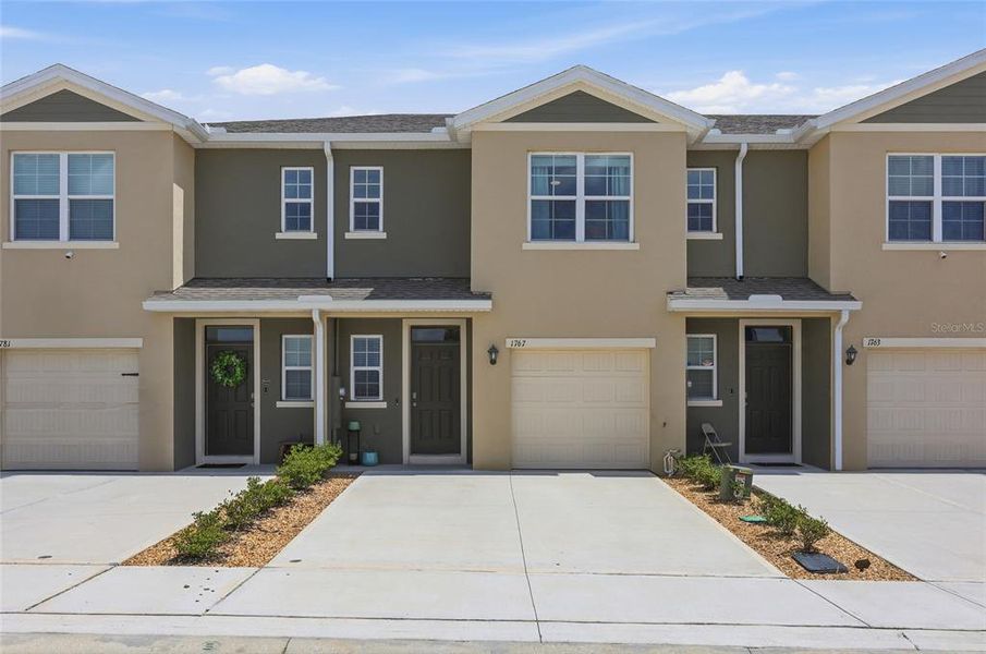 Front exterior of a new home in , Davenport, FL, highlighting curb appeal (Image 1). Front exterior of a new home in , Davenport, FL, highlighting curb appeal (Image 1).