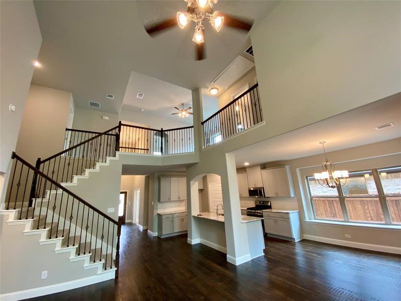 WOW! Check out the impressive wrought iron spindles and tall cathedral ceiling in the Great Room! WOW! Check out the impressive wrought iron spindles and tall cathedral ceiling in the Great Room!