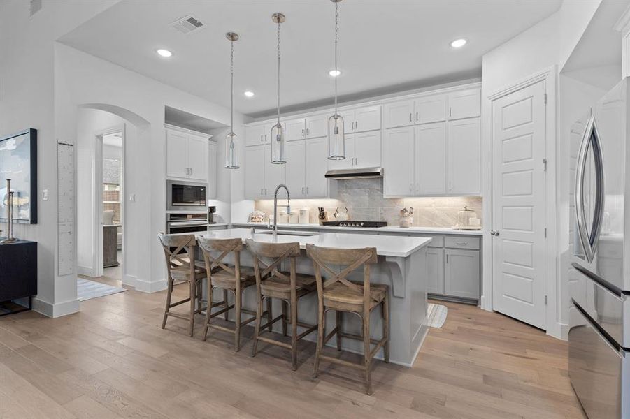 Clean-lined cabinetry, fresh finishes & ample prep areas make this an ideal kitchen for meal prep or entertaining. Stainless appliances included (except the refrigerator). Tucked away to the left is the primary bedroom. Clean-lined cabinetry, fresh finishes & ample prep areas make this an ideal kitchen for meal prep or entertaining. Stainless appliances included (except the refrigerator). Tucked away to the left is the primary bedroom.