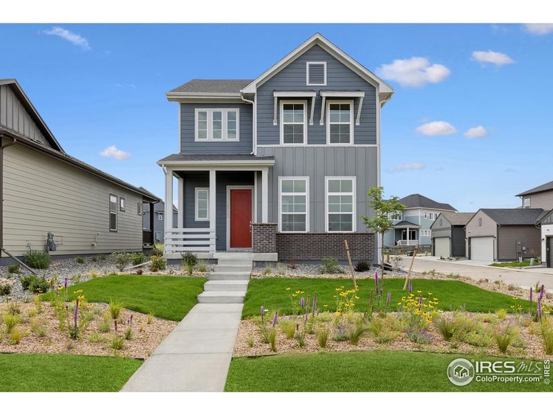 Front exterior of a new home in Kinston Cottage, Loveland, CO, highlighting curb appeal (Image 25).