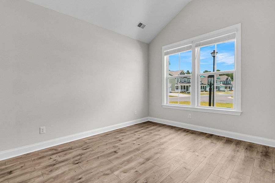 Spacious, unfurnished interior of a new home in Tidewater at Lakes of Cane Bay, Summerville (Image 18).
