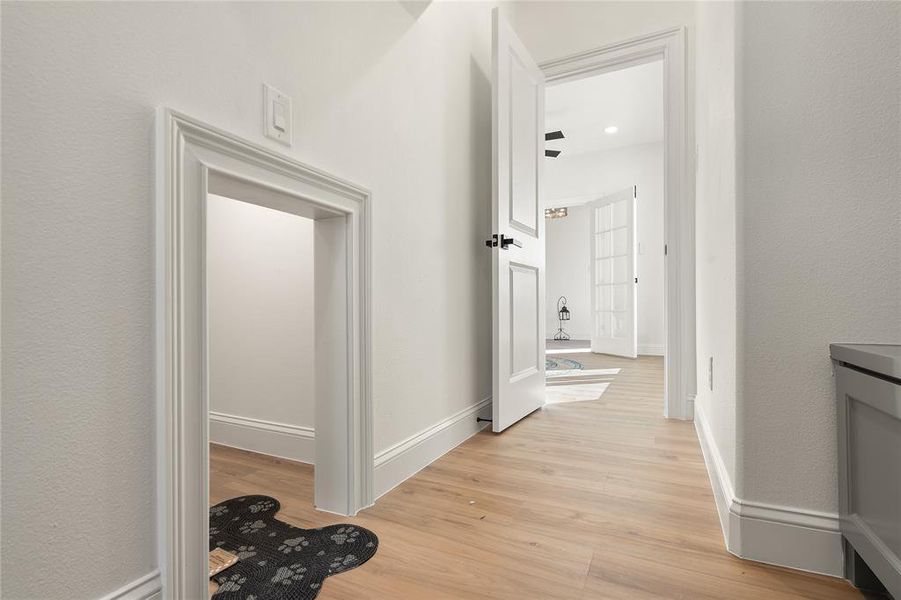 Hallway featuring light hardwood / wood-style flooring