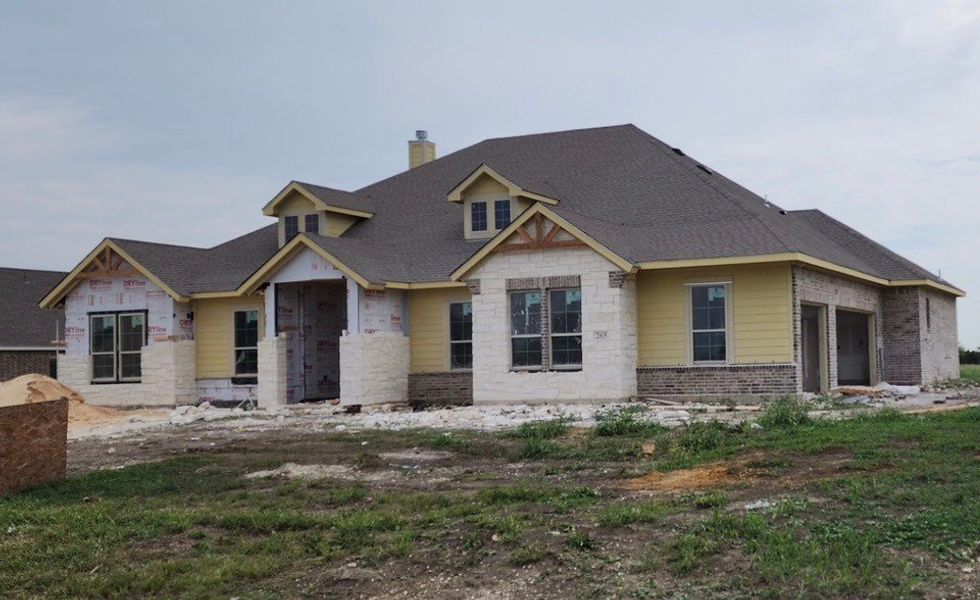 Front exterior of a new home in Fannin Ranch, Leonard, TX, highlighting curb appeal (Image 2). Front exterior of a new home in Fannin Ranch, Leonard, TX, highlighting curb appeal (Image 2).