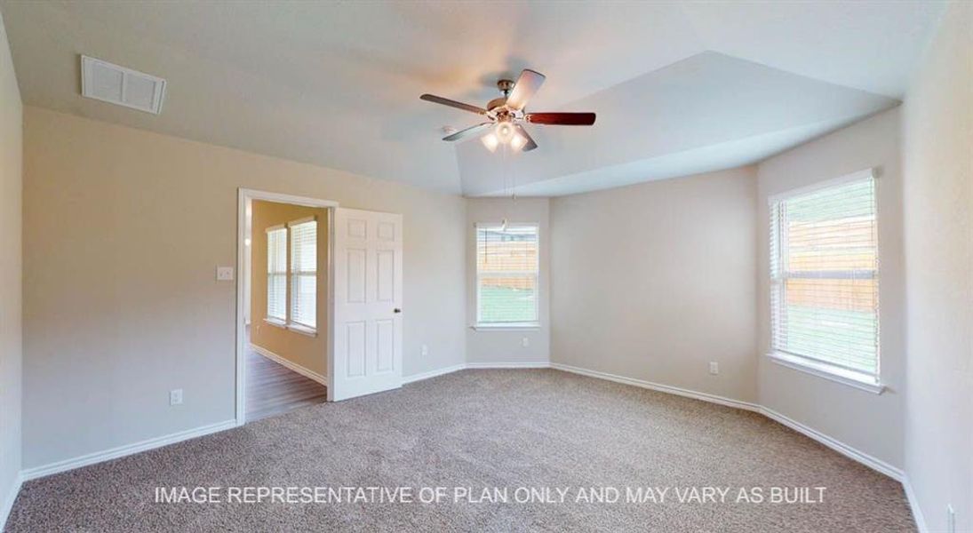 Spare room featuring carpet flooring, healthy amount of natural light, and a ceiling fan Spare room featuring carpet flooring, healthy amount of natural light, and a ceiling fan