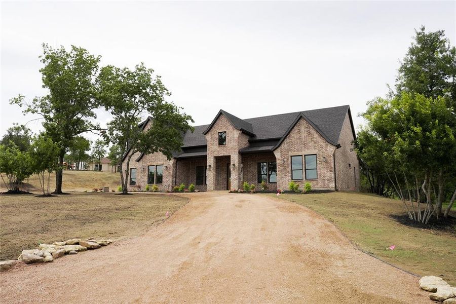 Front exterior of a new home in , Weatherford, TX, highlighting curb appeal (Image 25). Front exterior of a new home in , Weatherford, TX, highlighting curb appeal (Image 25).