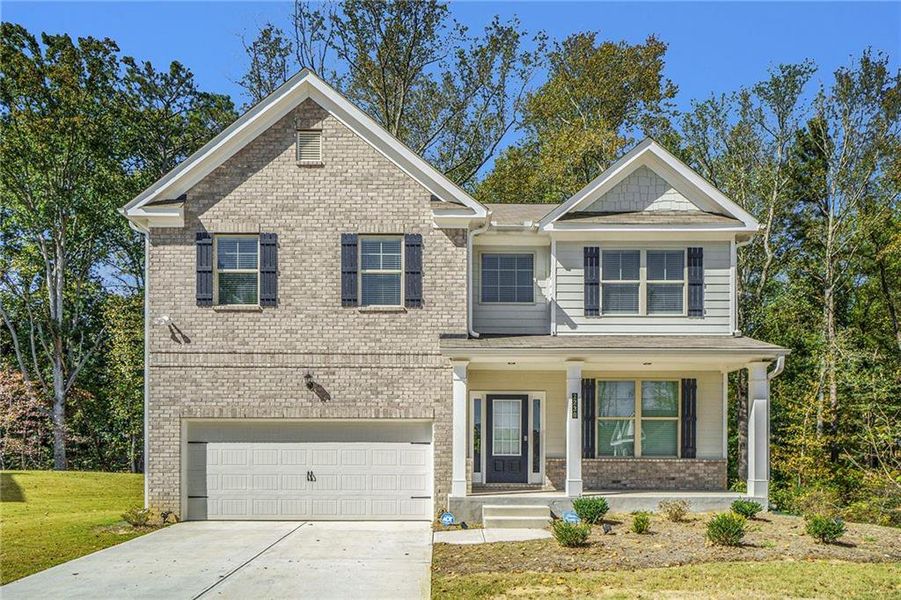 Front exterior of a new home in Paces Estates, Lithia Springs, GA, highlighting curb appeal (Image 24). Front exterior of a new home in Paces Estates, Lithia Springs, GA, highlighting curb appeal (Image 24).